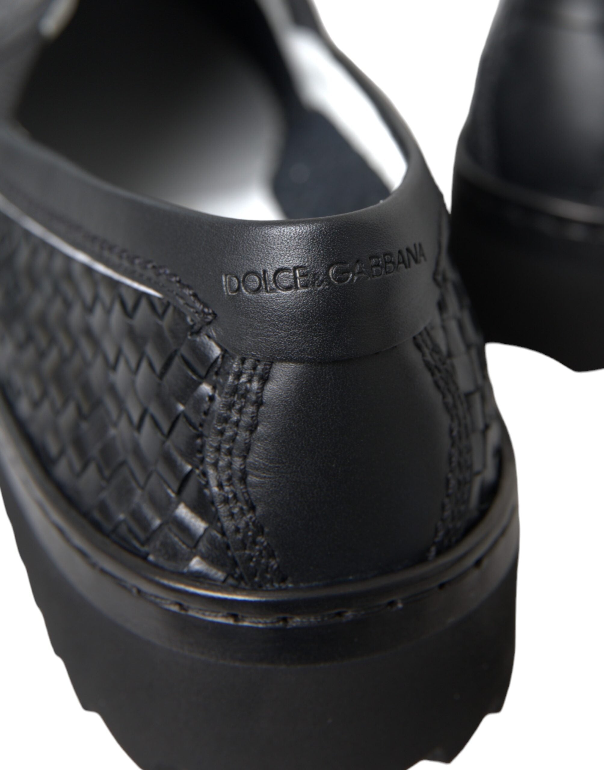 Black woven buffalo leather men's loafers by Dolce & Gabbana, featuring a sleek design and classic slip-on style.