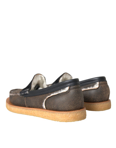 Dolce & Gabbana men's brown and black fur leather loafers with sleek design and classic slip-on style.