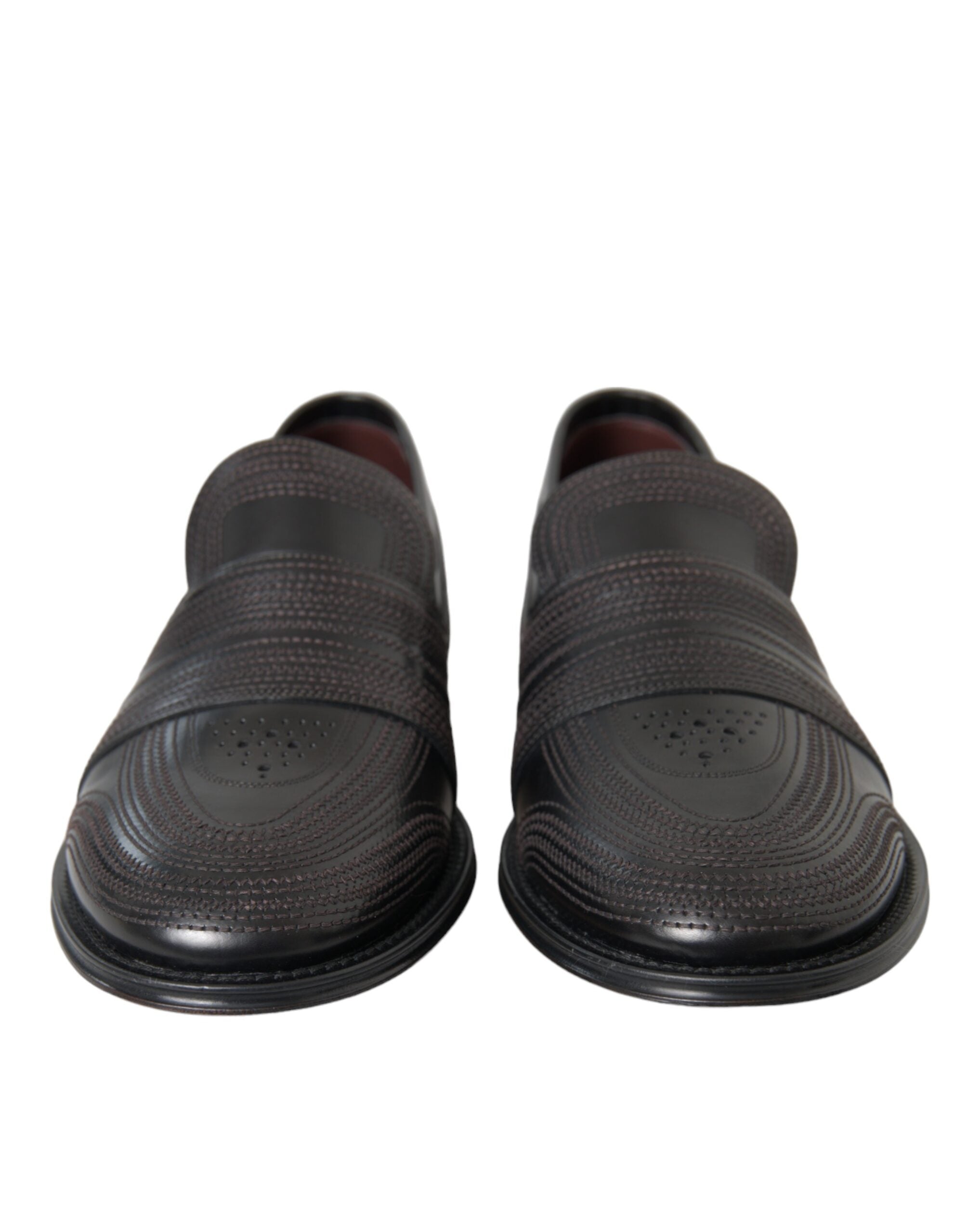 Black and brown leather men's loafer dress shoe by Dolce & Gabbana with sleek, polished design and classic slip-on style.