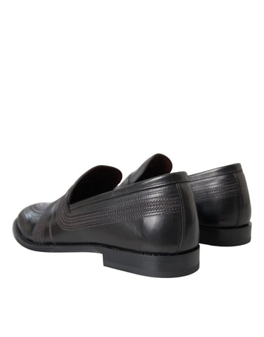 Black and brown leather men's loafer dress shoes by Dolce & Gabbana, featuring sleek design and polished finish.