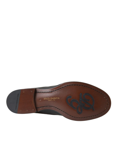 Black and brown leather loafers for men by Dolce & Gabbana, featuring classic dress shoe design and sleek leather finish.