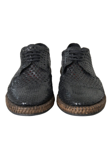 Black woven goat leather lace-up derby shoes by Dolce & Gabbana, showing detailed woven texture and classic design.