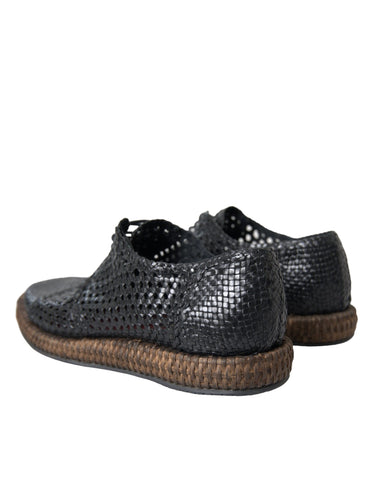 Black woven goat leather lace-up derby shoes by Dolce & Gabbana, featuring intricate woven pattern and classic derby style.