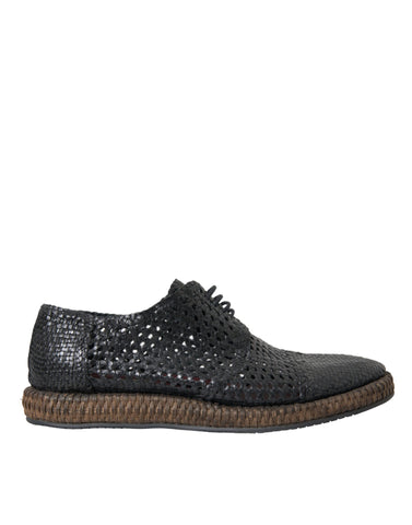 Black woven goat leather lace-up derby shoes by Dolce & Gabbana with detailed stitching and classic design.
