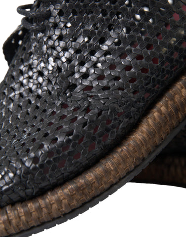 Black woven goat leather lace-up derby shoes by Dolce & Gabbana, featuring detailed weaving and classic design.