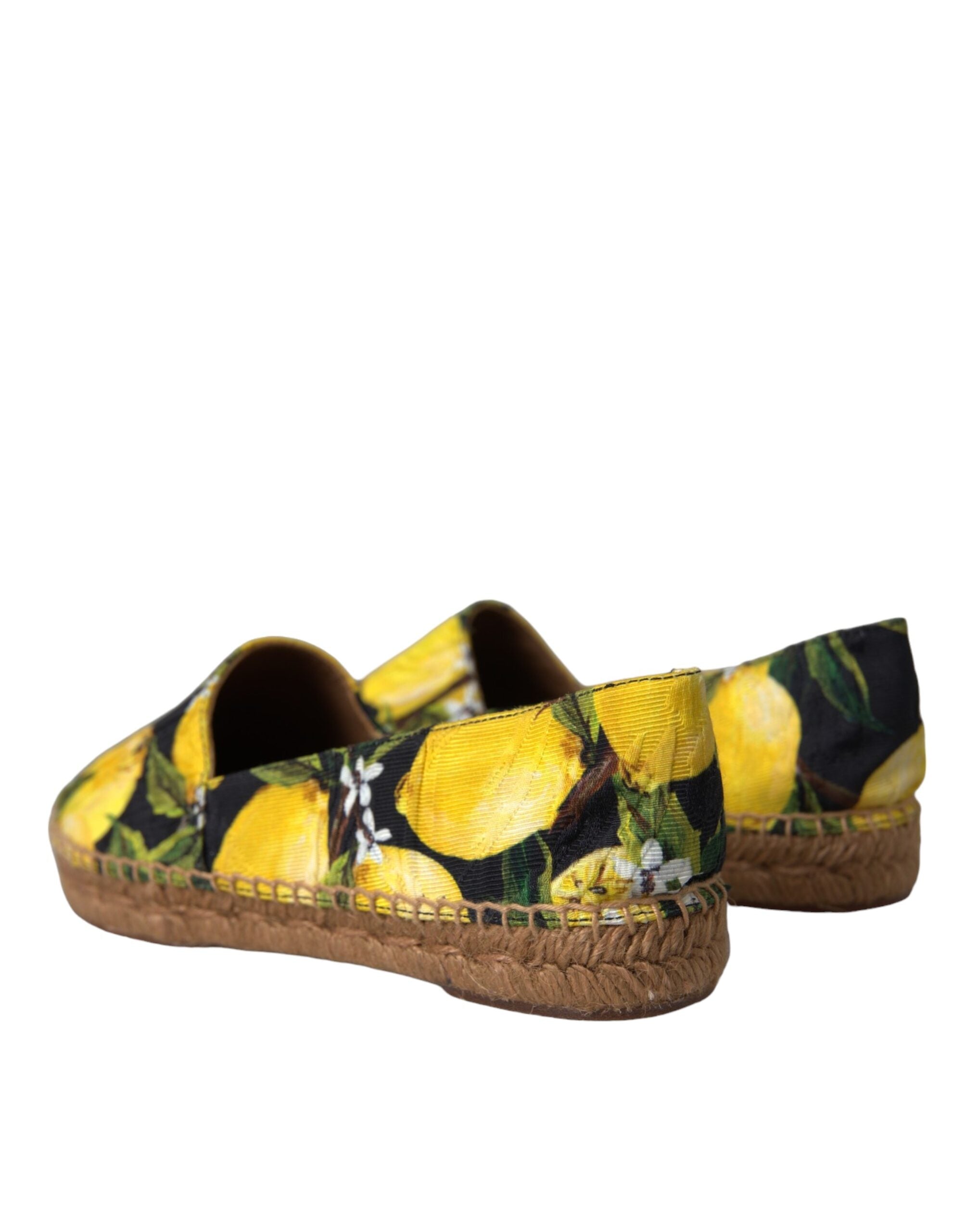 Multicolor lemon slip-on espadrilles shoes by Dolce & Gabbana with woven jute sole and vibrant lemon pattern.