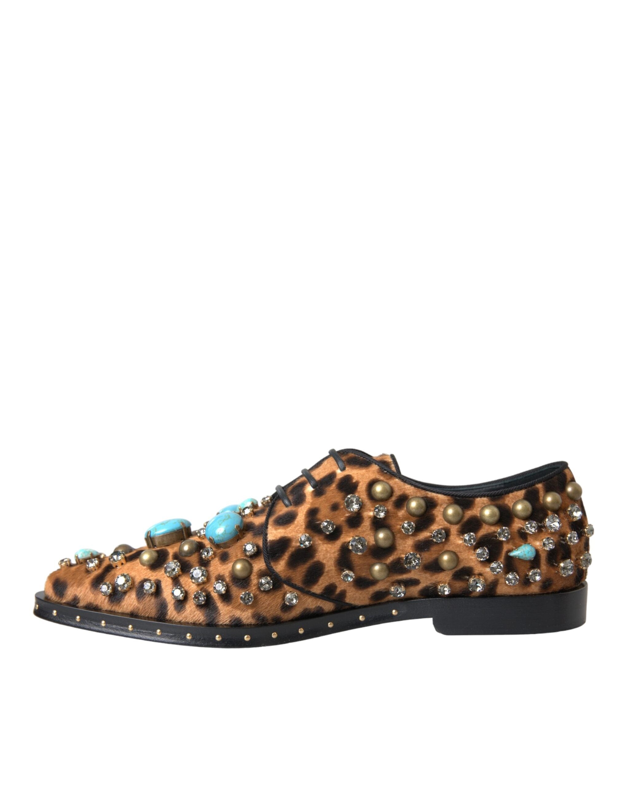 Brown leopard print crystal-embellished brogue shoes by Dolce & Gabbana, featuring detailed stitching and stylish design.