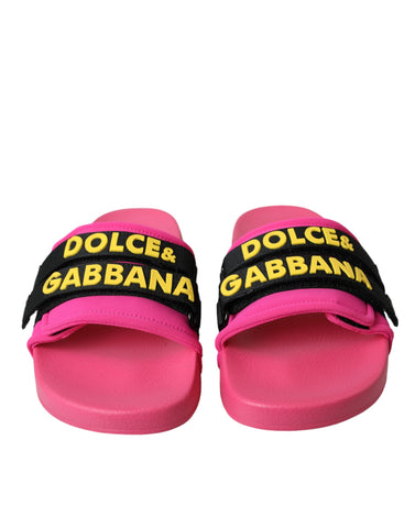 Pink and black logo Dolce & Gabbana beachwear flats sandals with open-toe design and stylish branding details.