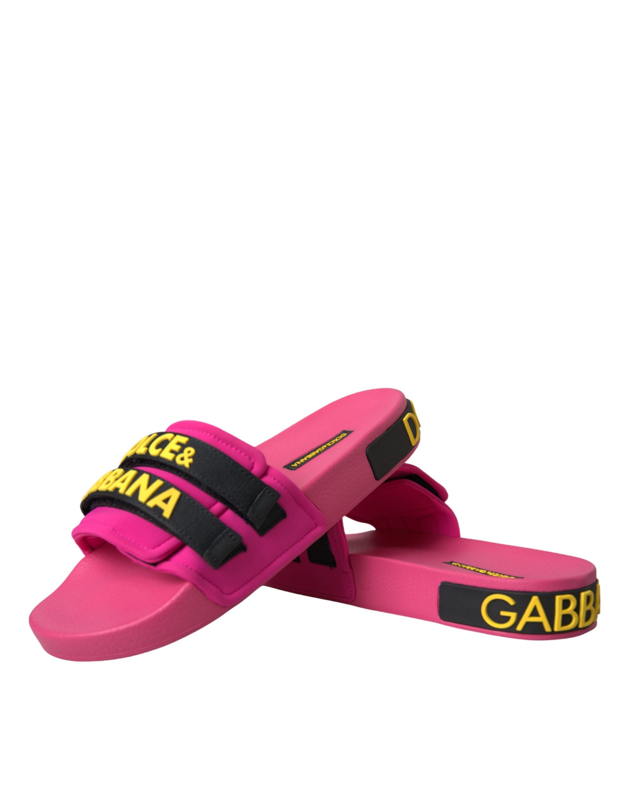 Pink and black Dolce & Gabbana logo beachwear flats sandals showing stylish slip-on design and branded logo on the straps.