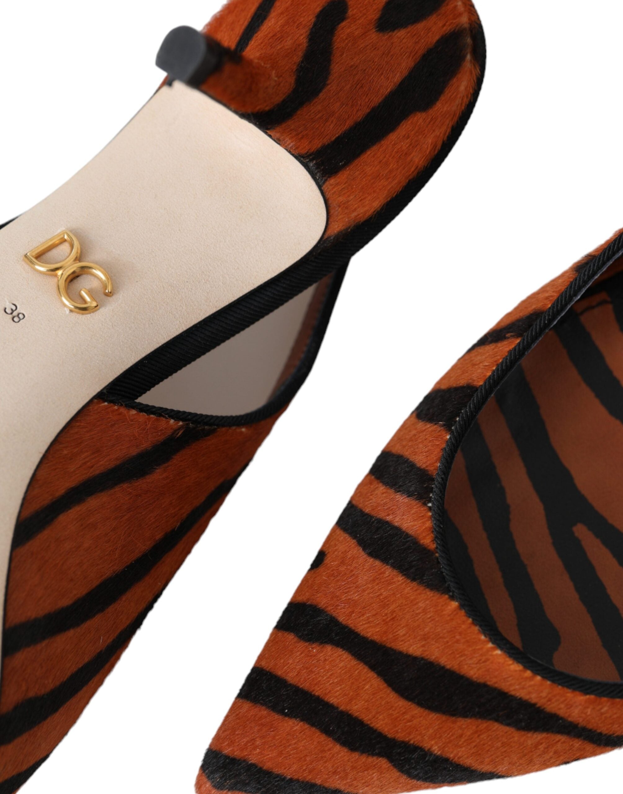 Dolce & Gabbana black and orange zebra leather slingback shoes with pointed toes and ankle straps.