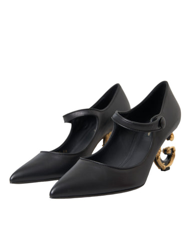 Dolce & Gabbana black leather Mary Jane heels with logo detail, stylish pump shoes with rounded toe and ankle strap.