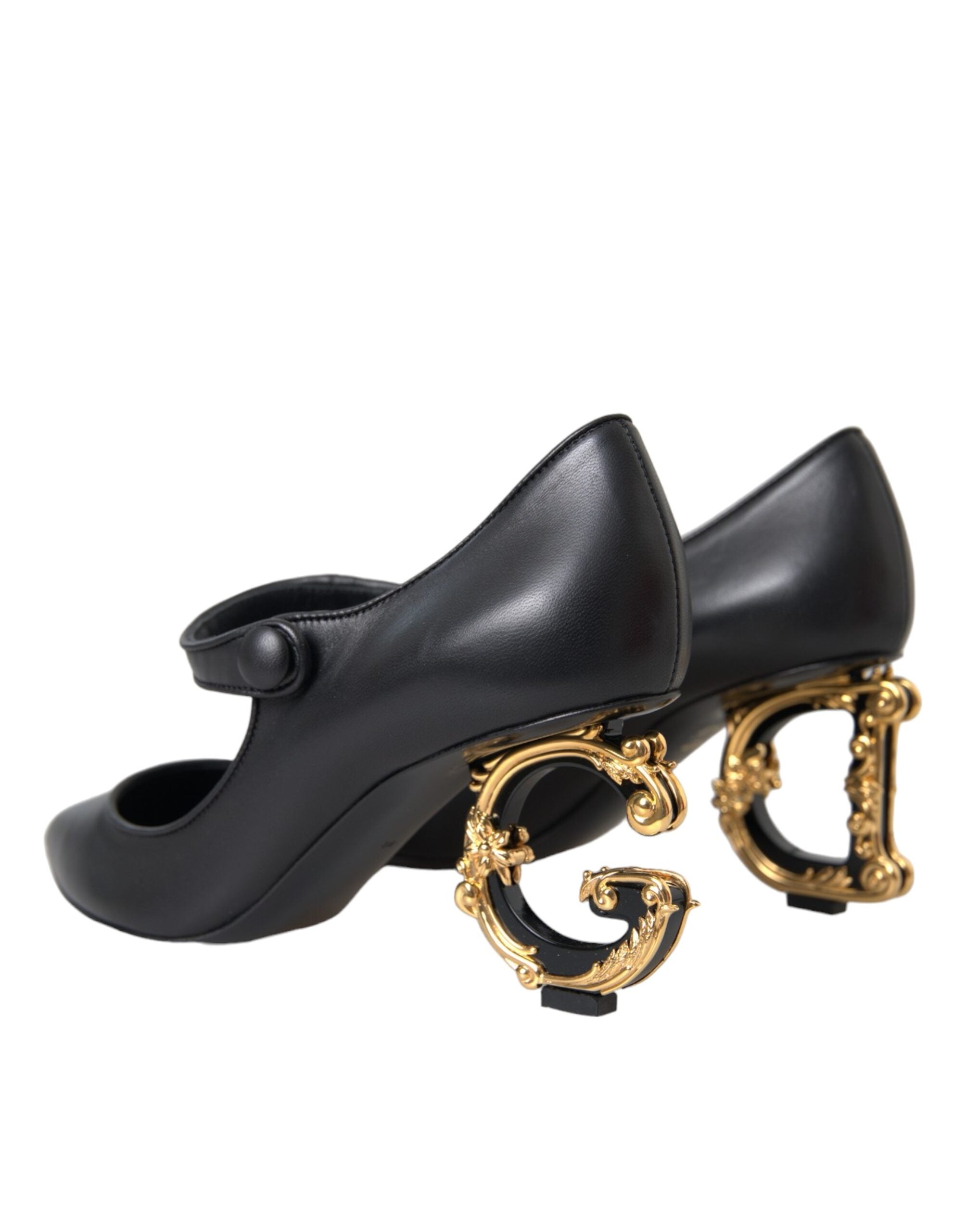 Black leather Mary Jane pumps with logo detailing from Dolce & Gabbana, featuring a classic heel and rounded toe.