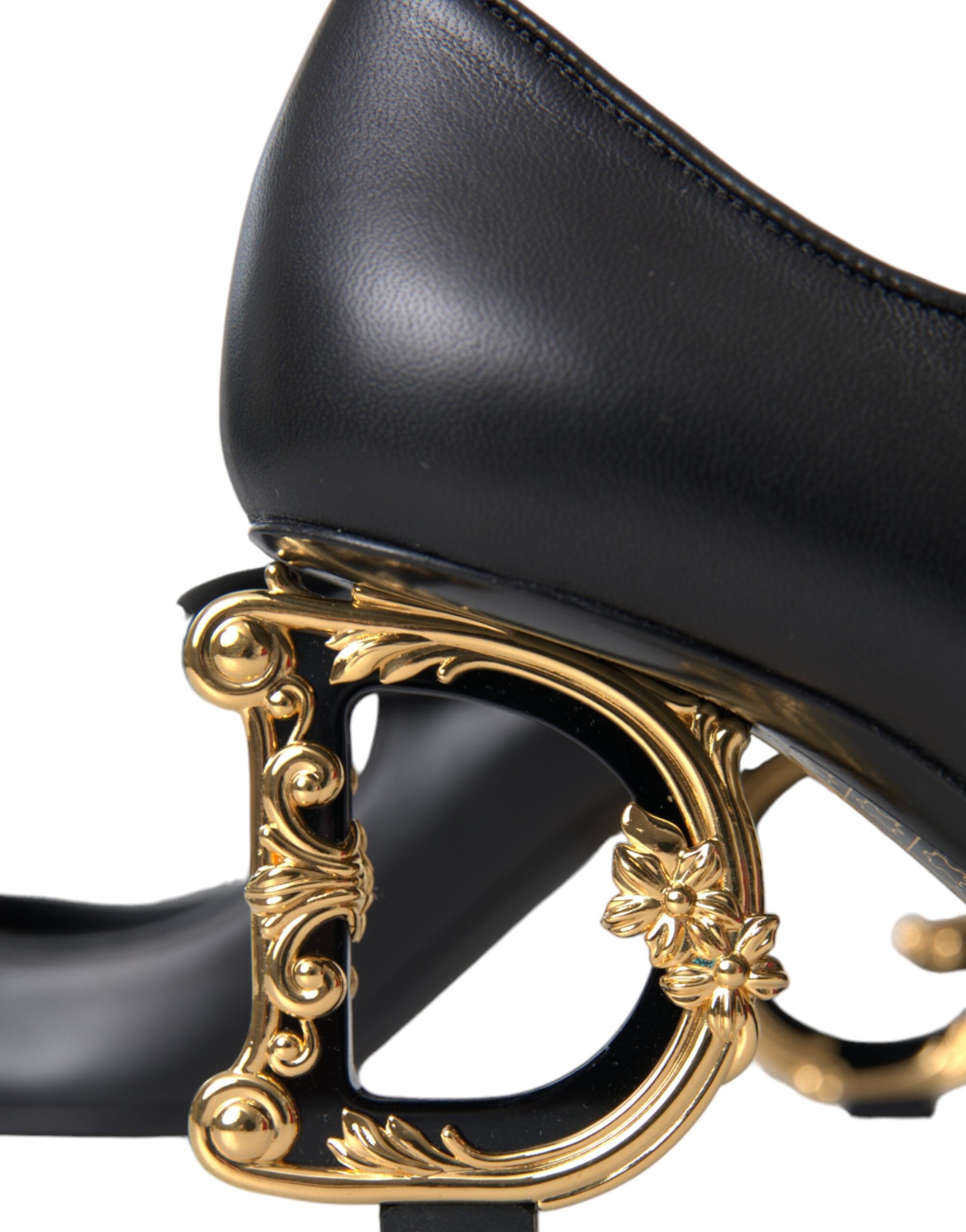 Black leather Mary Janes pumps with Dolce & Gabbana logo detailing, featuring a classic heel and sleek design.