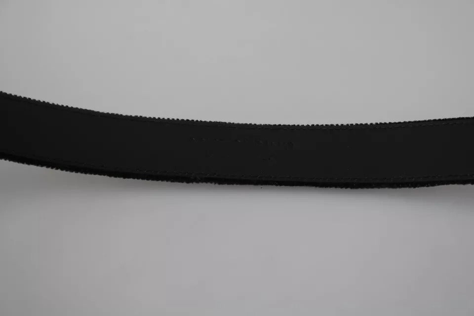 Black velvet men's belt with silver tone metal buckle by Dolce & Gabbana, featuring a sleek, stylish design.