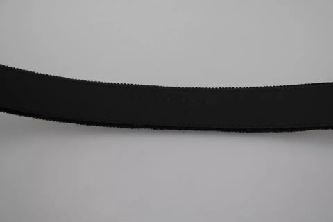 Black velvet men's belt with silver tone metal buckle by Dolce & Gabbana, featuring a sleek, stylish design.
