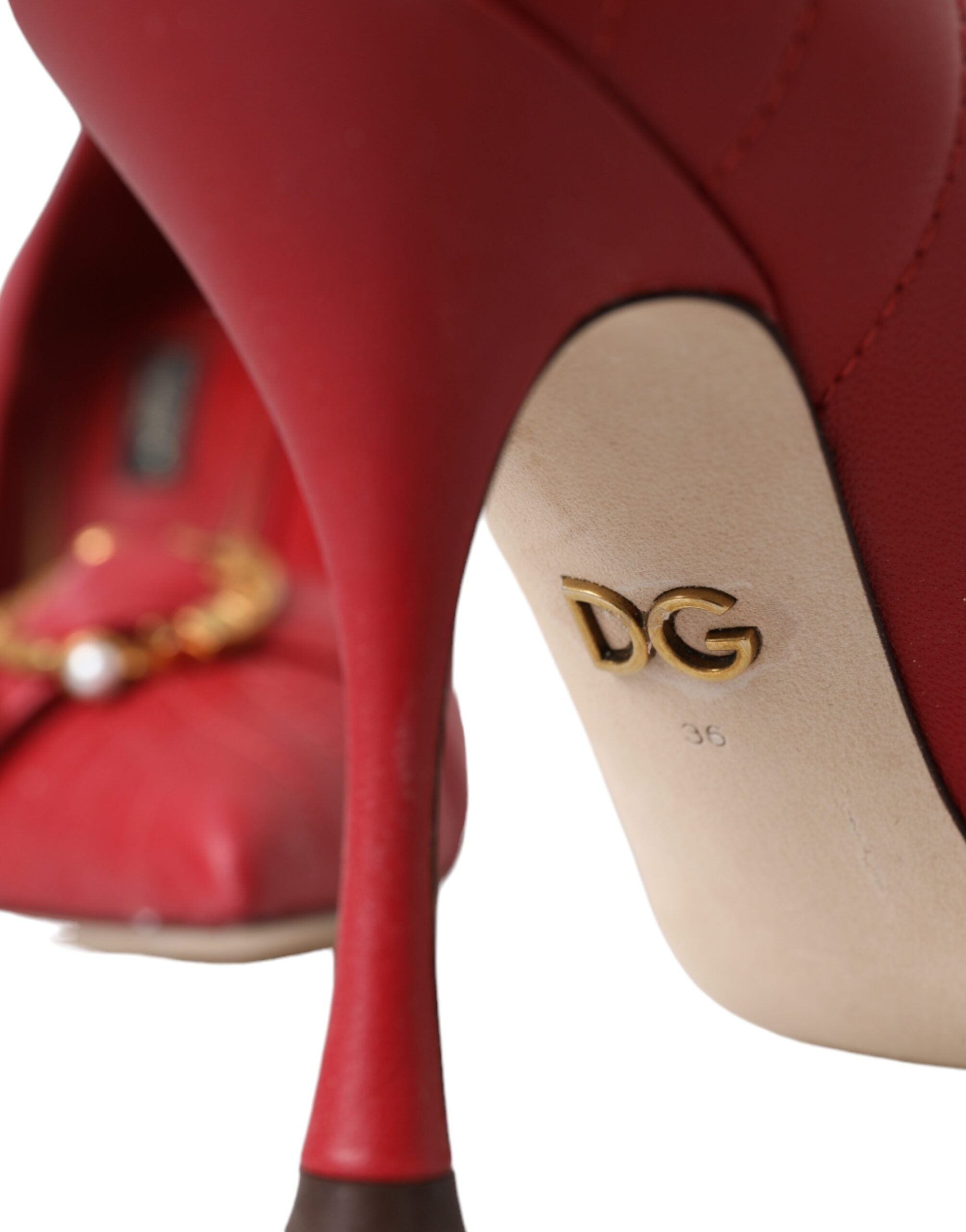 Red leather heels pumps from Dolce & Gabbana with pointed toes and sleek design, perfect for elegant occasions.