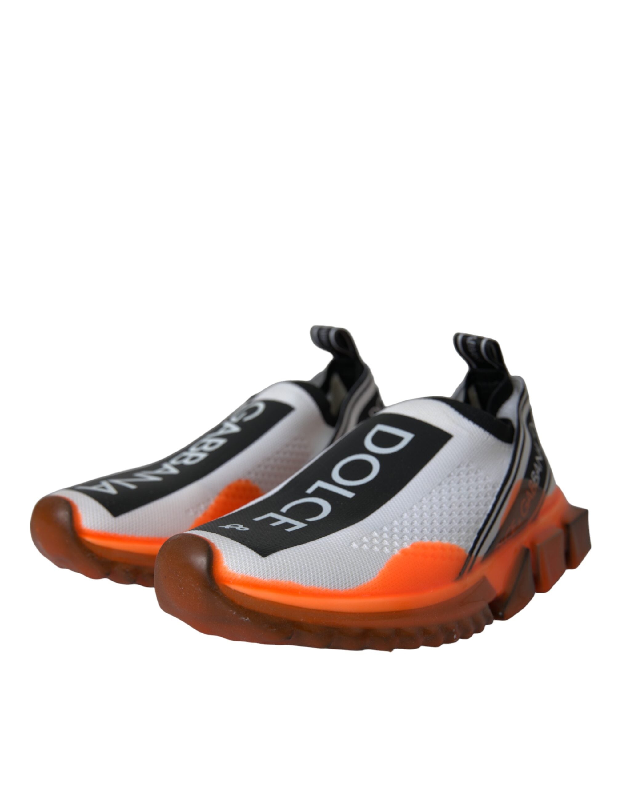 Black, white, and orange Dolce & Gabbana slip-on Sorrento sneakers with stylish design and casual footwear appeal.
