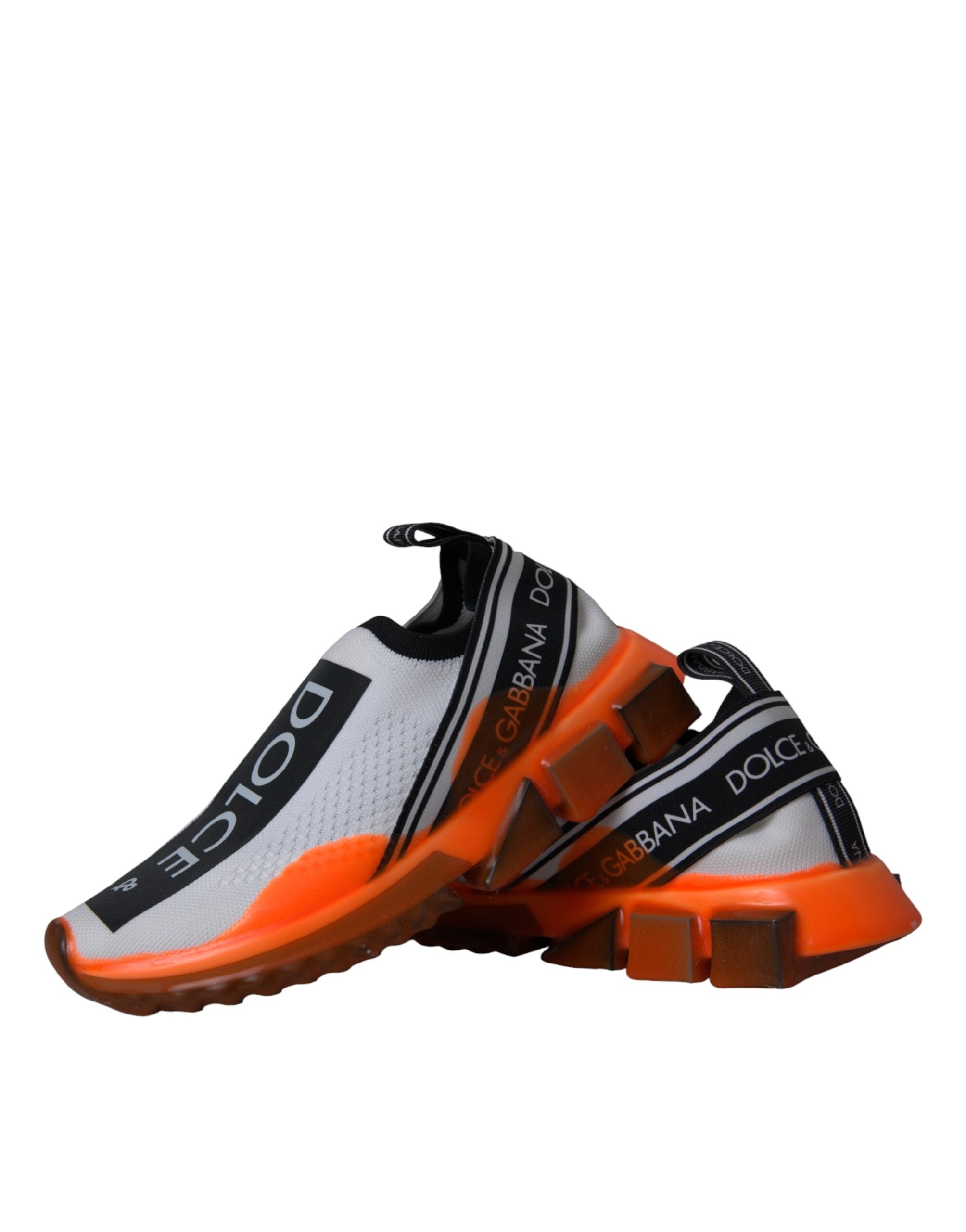 Dolce & Gabbana slip-on sneakers in black, white, and orange with sleek design and casual sneaker style.