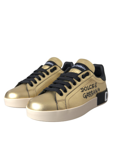 Dolce & Gabbana Gold Portofino calf leather sneakers for women, stylish casual shoes with gold accents and lace-up design.