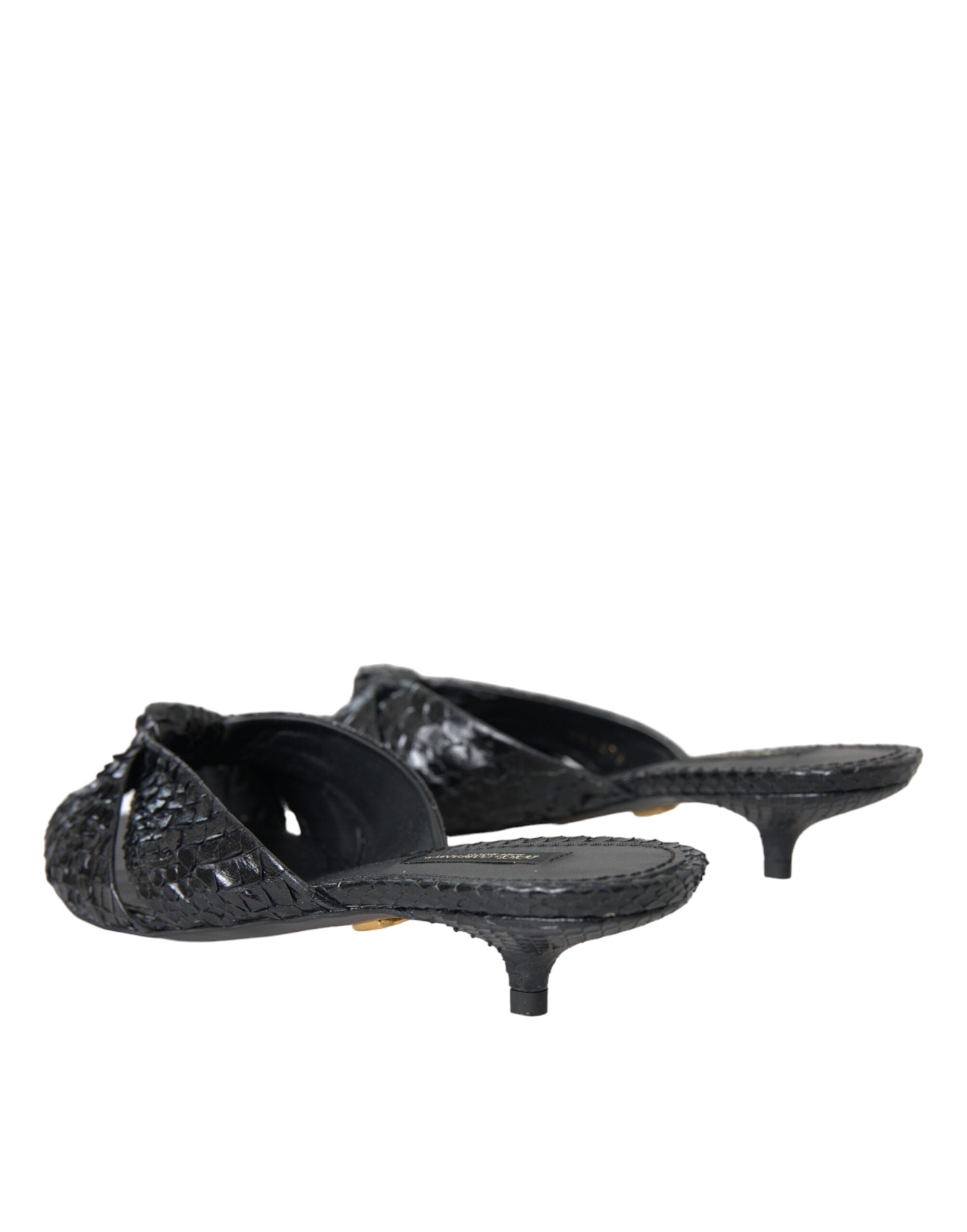 Black exotic leather slide sandals with open toes and chunky heels by Dolce & Gabbana, featuring bold, textured leather straps.