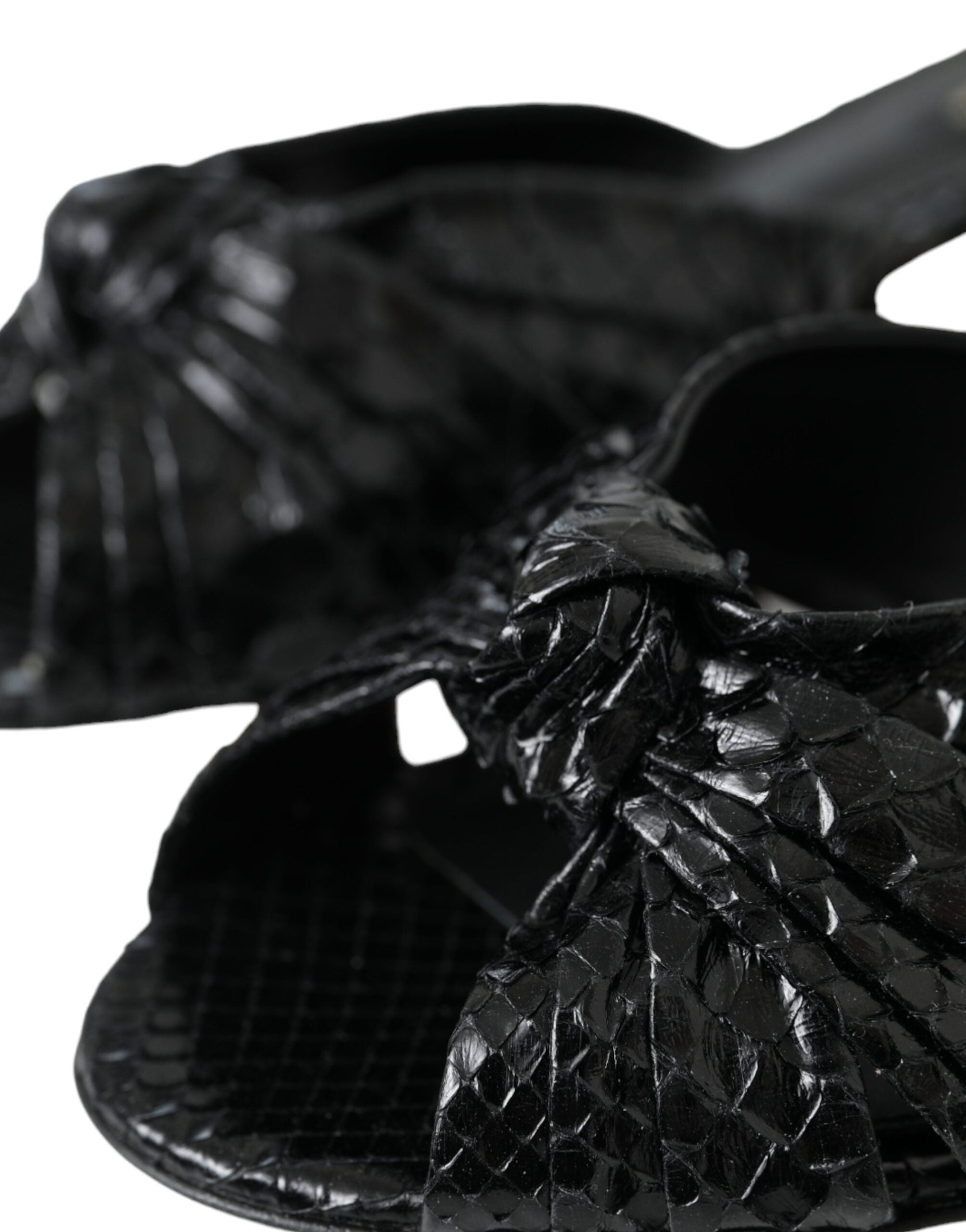 Black exotic leather slides shoes by Dolce & Gabbana featuring sleek design and open-toe style.