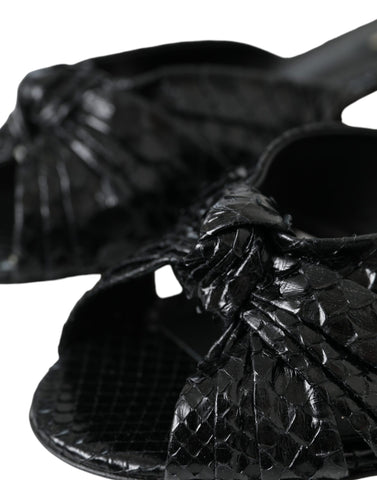 Black exotic leather slides shoes by Dolce & Gabbana featuring sleek design and open-toe style.
