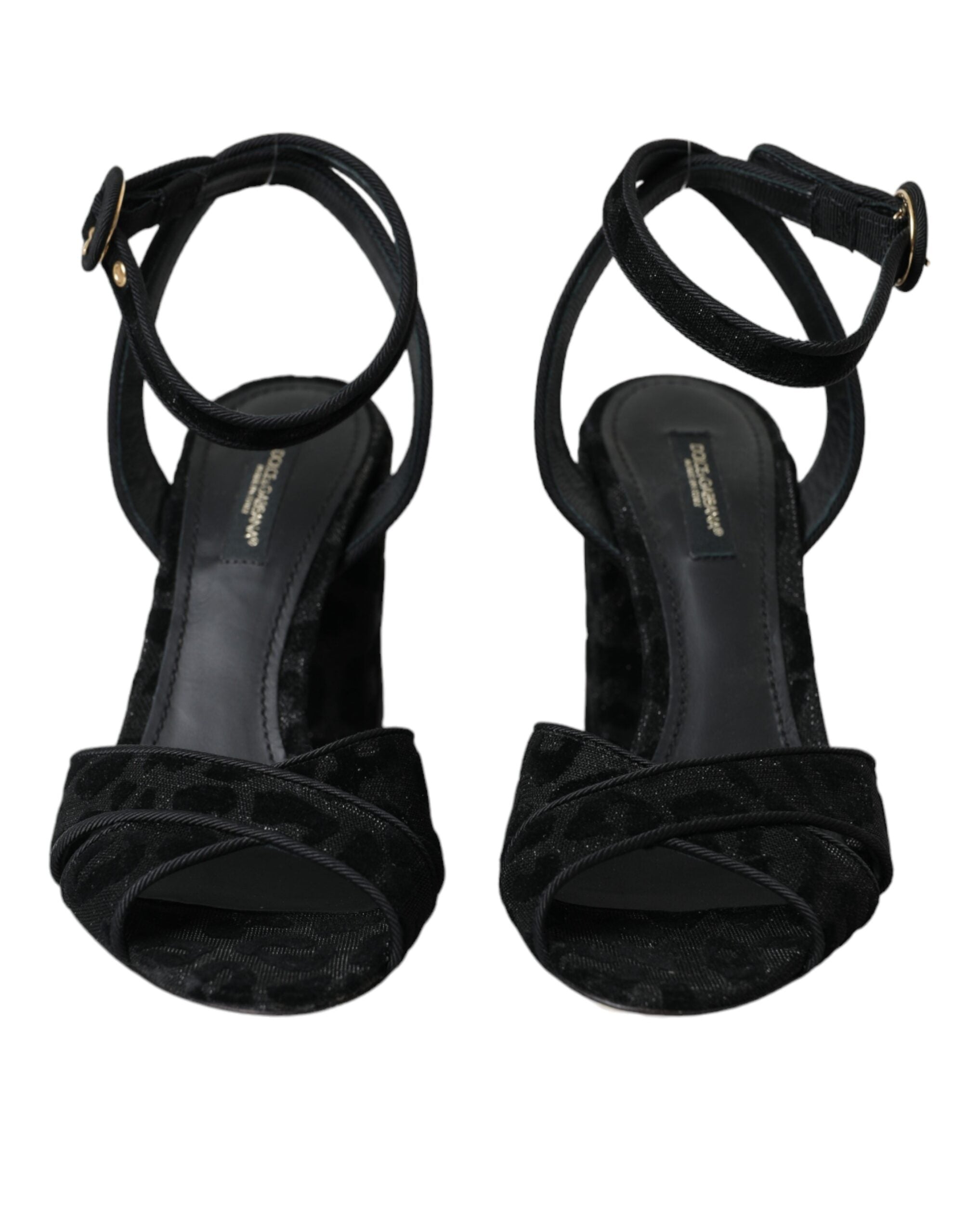 Black leopard print suede heels sandals by Dolce & Gabbana with ankle straps and pointed toes, stylish and elegant footwear.