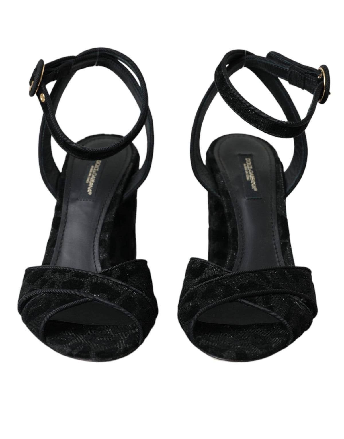 Black leopard print suede heels sandals by Dolce & Gabbana with ankle straps and pointed toes, stylish and elegant footwear.