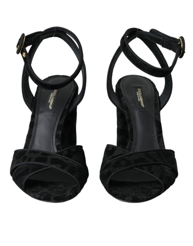 Black leopard print suede heels sandals by Dolce & Gabbana with ankle straps and pointed toes, stylish and elegant footwear.