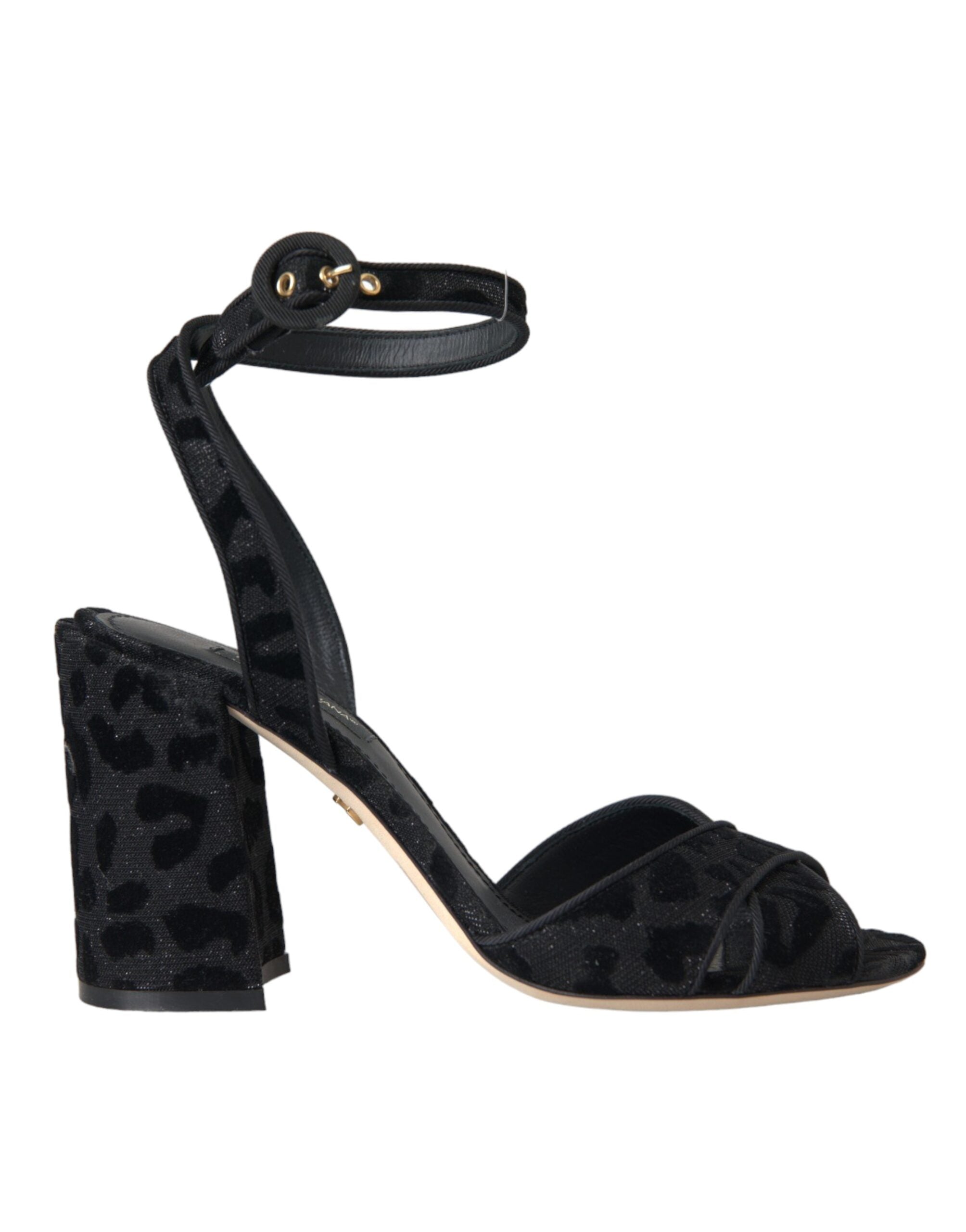 Black leopard print suede heels sandals by Dolce & Gabbana with open toes and ankle straps, stylish and elegant footwear.