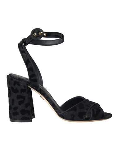 Black leopard print suede heels sandals by Dolce & Gabbana with open toes and ankle straps, stylish and elegant footwear.