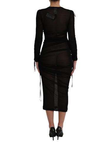 Black sheer bodycon sheath midi dress by Dolce & Gabbana, featuring a fitted silhouette and elegant sheer fabric.