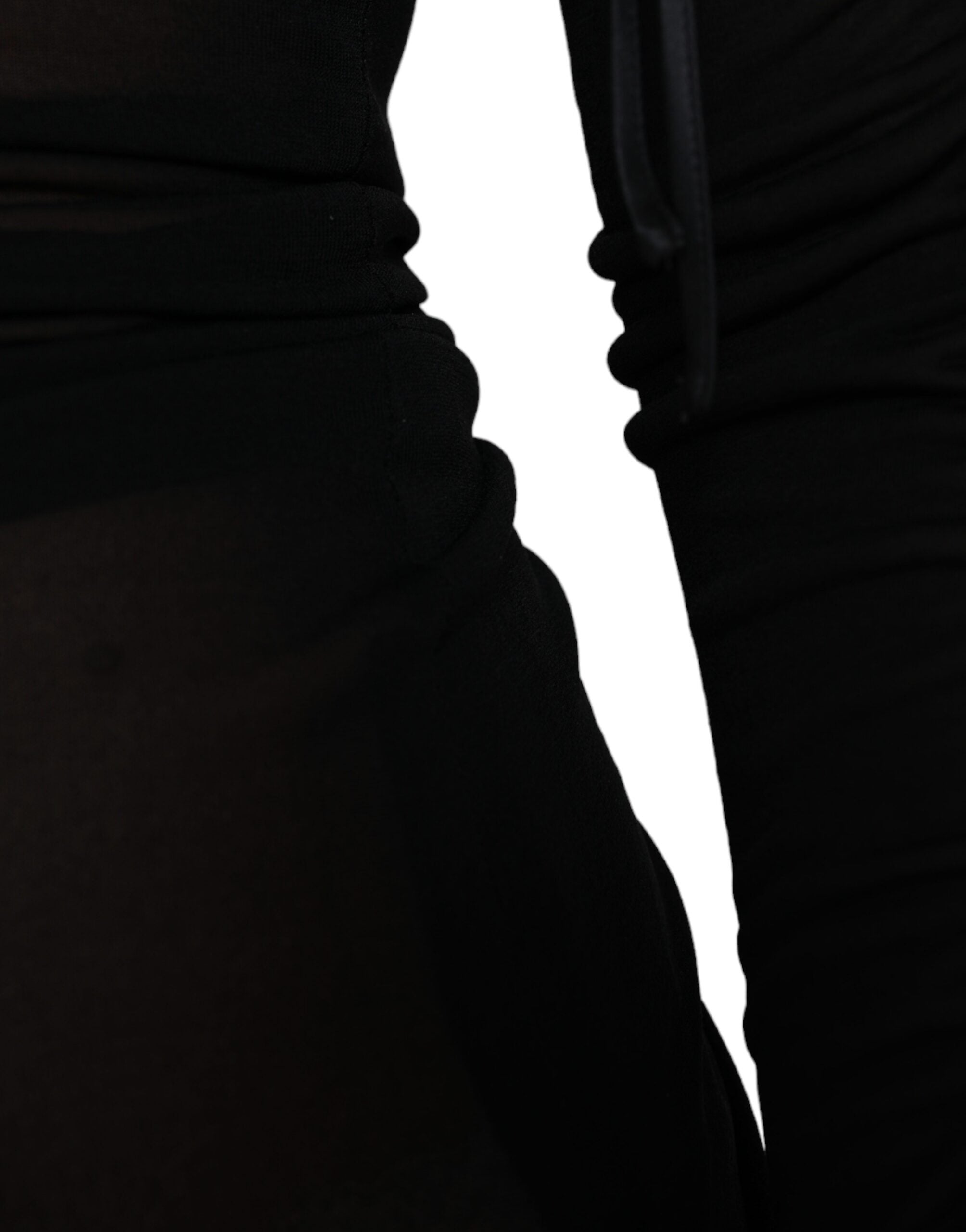 Black sheer bodycon sheath midi dress by Dolce & Gabbana, close-up of fitted design and elegant fabric details.