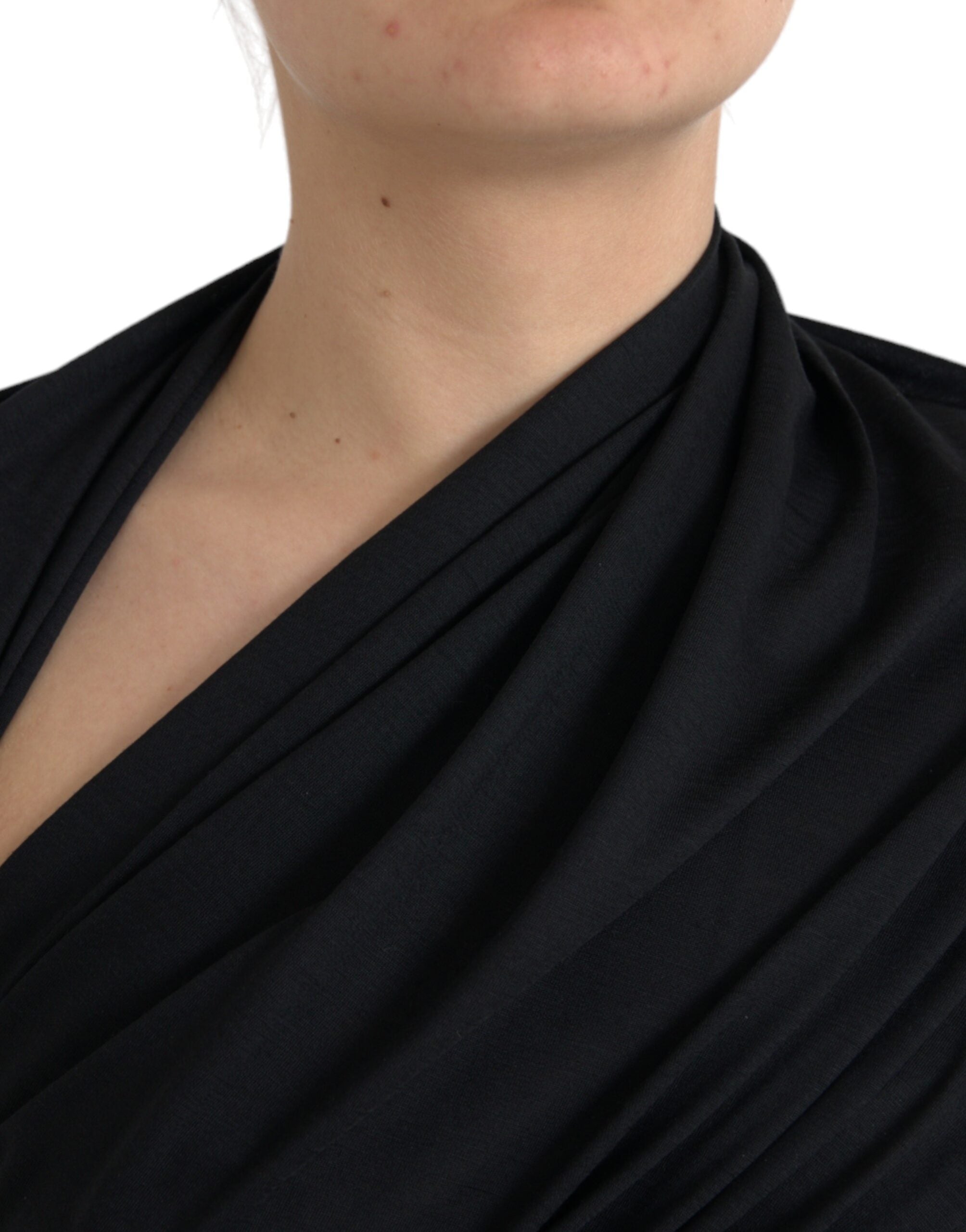 Black wool cutout asymmetric long sleeve top by Dolce & Gabbana, featuring a stylish design with unique cutout details.