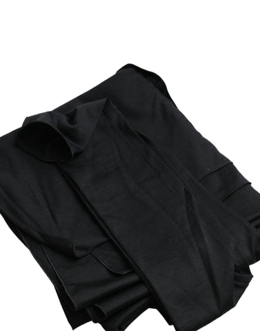 Black wool asymmetric long sleeve top with cutout design by Dolce & Gabbana, showcasing a stylish and modern fashion piece.