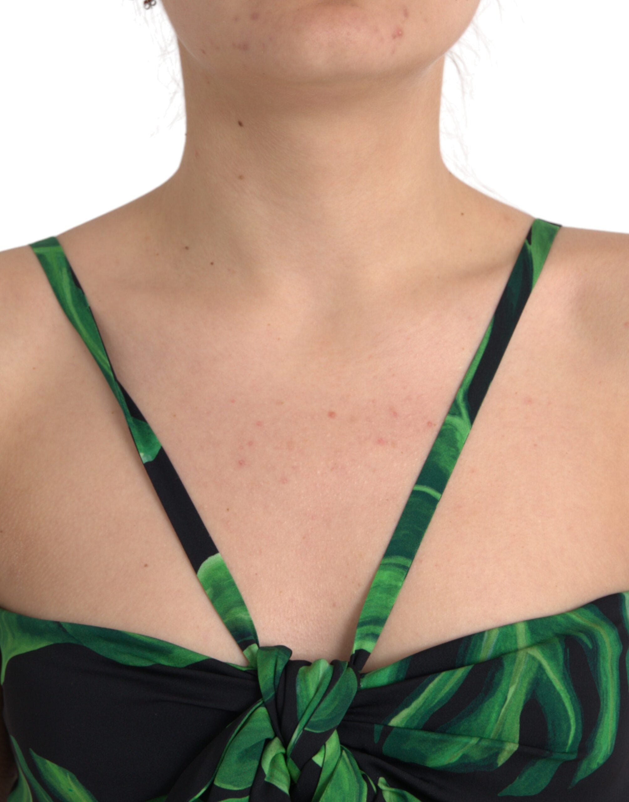 Black green leaf silk halter cropped top by Dolce & Gabbana, featuring a stylish halter neckline and leafy pattern.