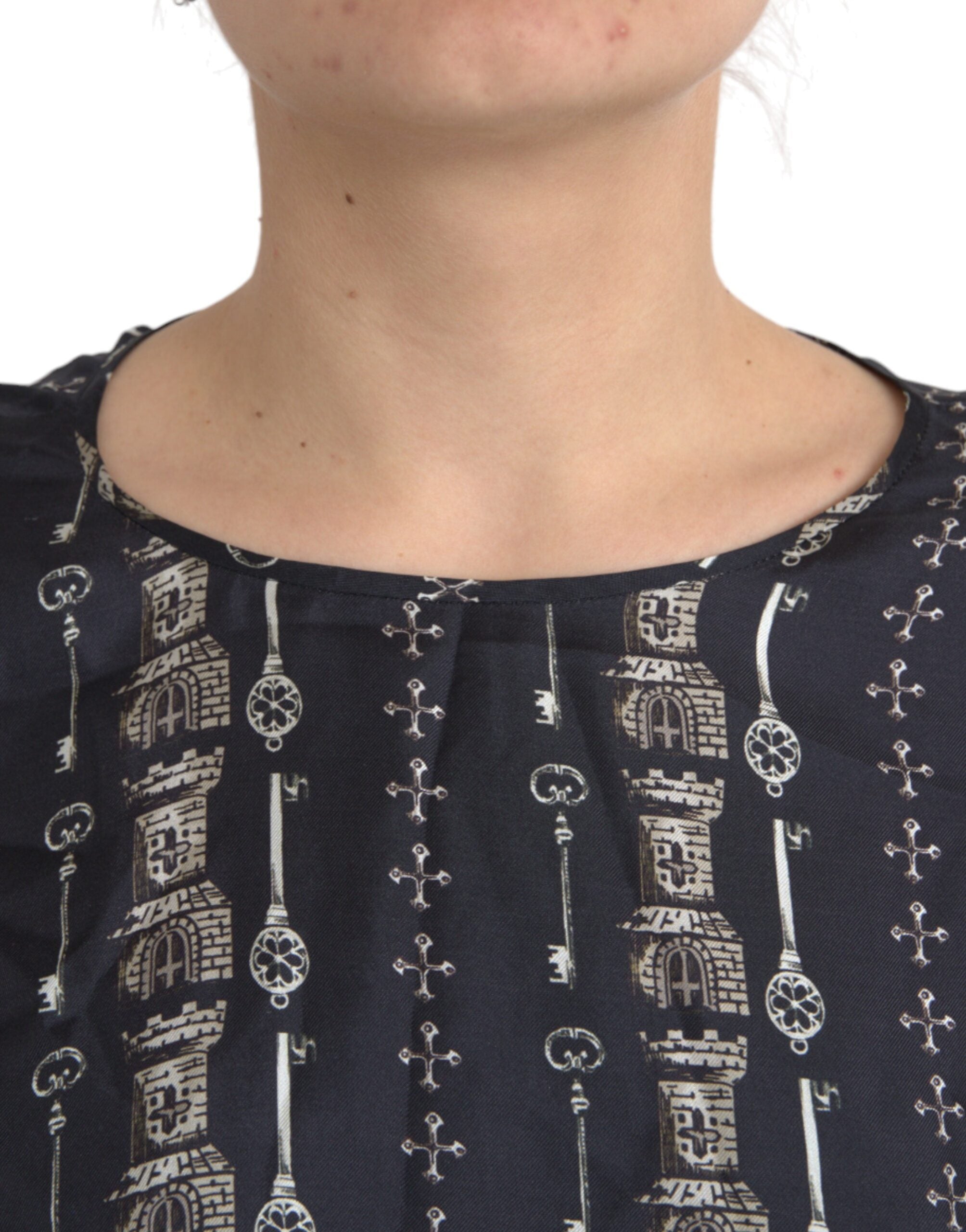 Black silk blouse with castle print by Dolce & Gabbana, featuring a relaxed fit and elegant design.