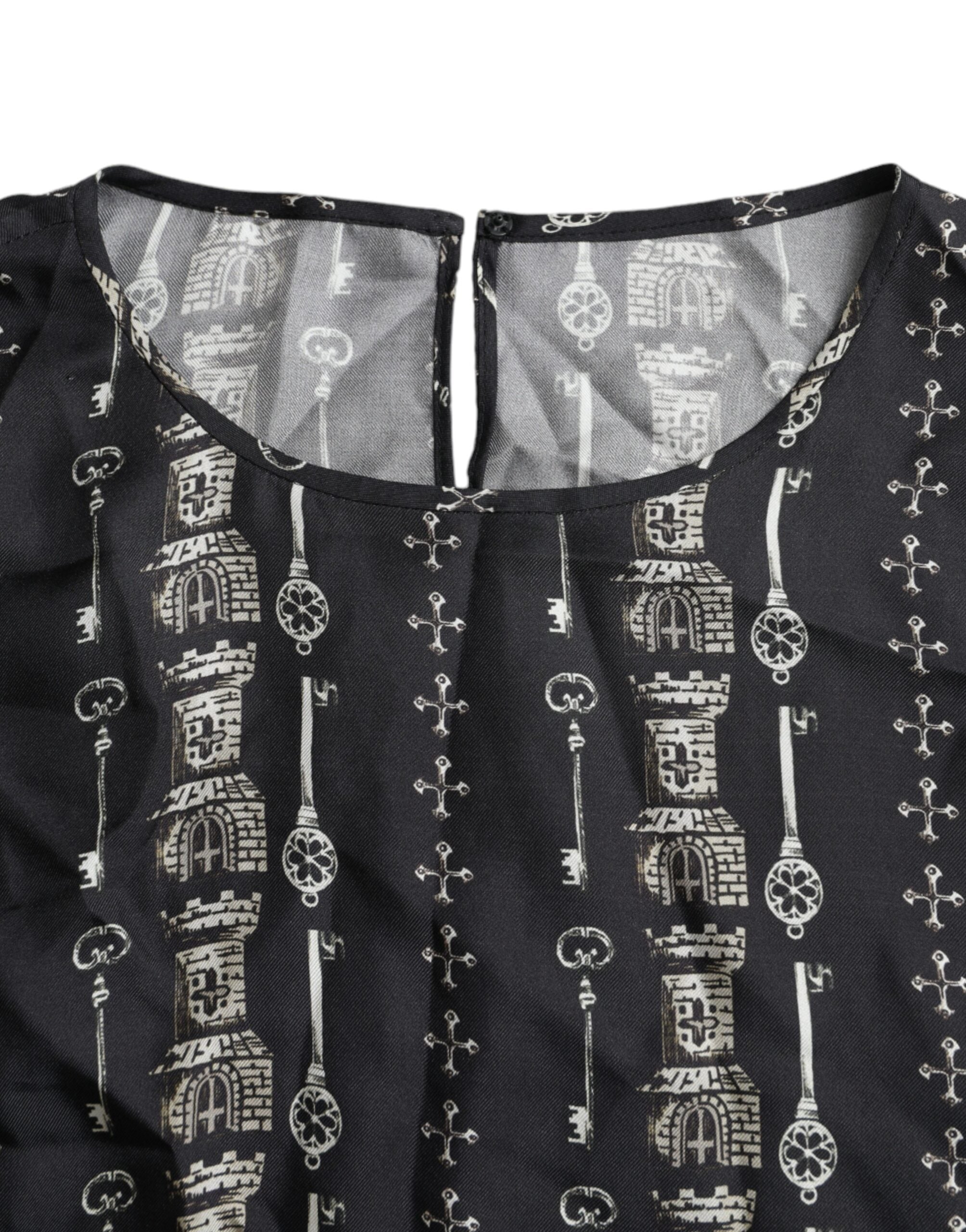 Black silk blouse with castle print and key design by Dolce & Gabbana, featuring a stylish T-shirt silhouette.