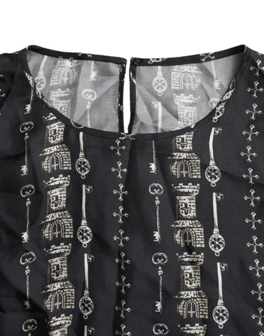 Black silk blouse with castle print and key design by Dolce & Gabbana, featuring a stylish T-shirt silhouette.