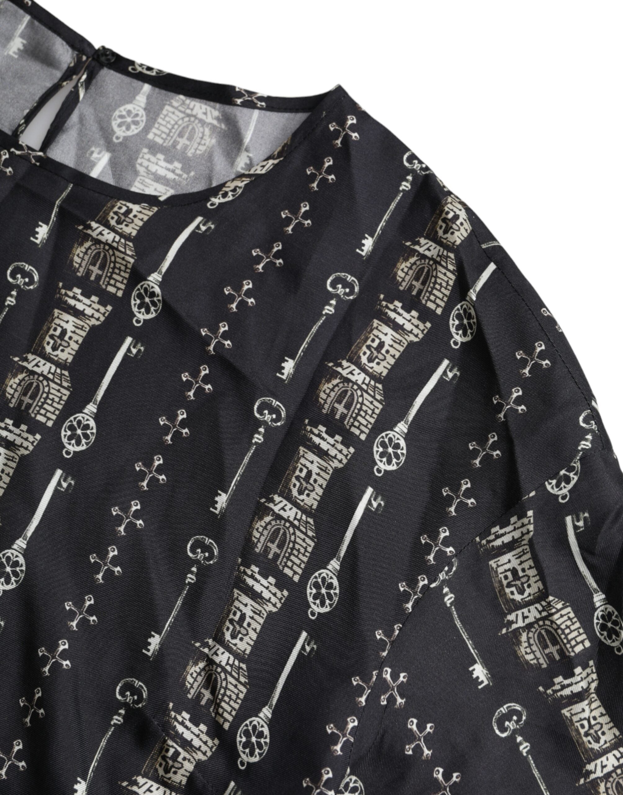 Black silk blouse with castle print, Dolce & Gabbana T-shirt featuring a stylish key design and elegant fabric.