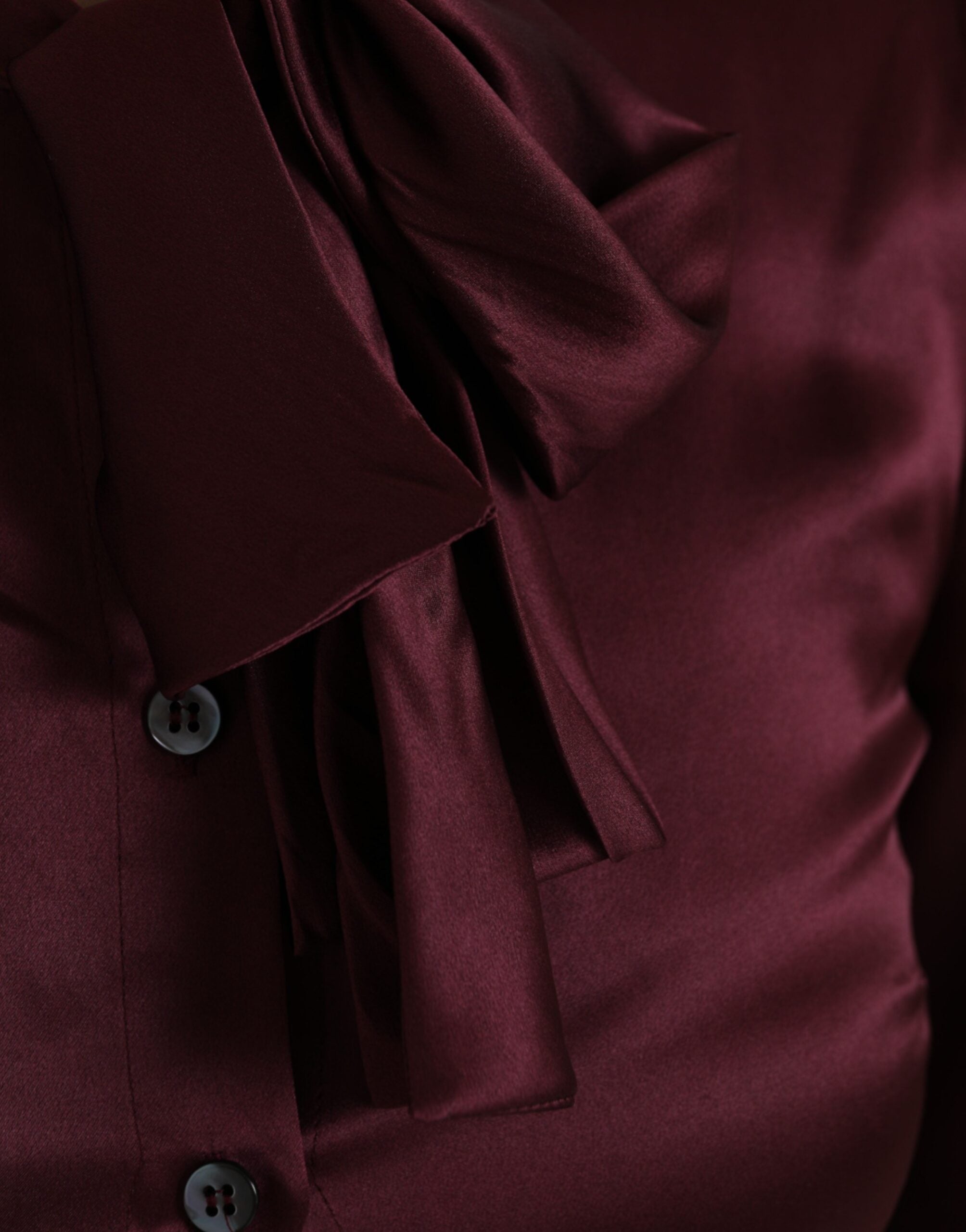 Maroon Dolce & Gabbana long sleeve blouse with ascot collar, stylish and elegant top with a sophisticated design.