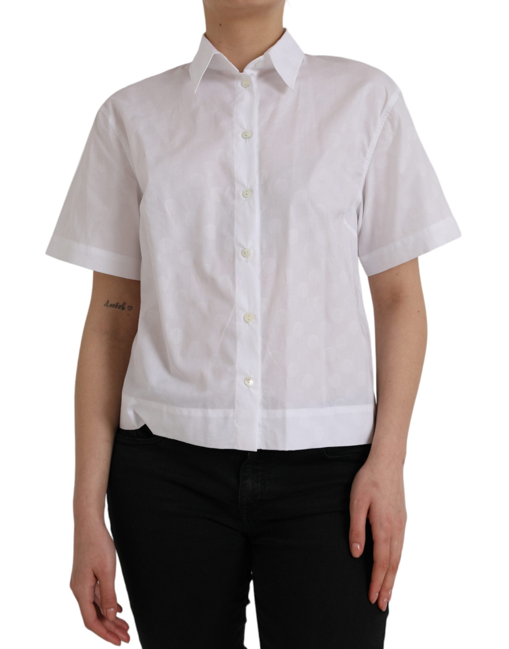 White Dolce & Gabbana short sleeve polo shirt with a collared neckline and button placket, displayed on a plain background.