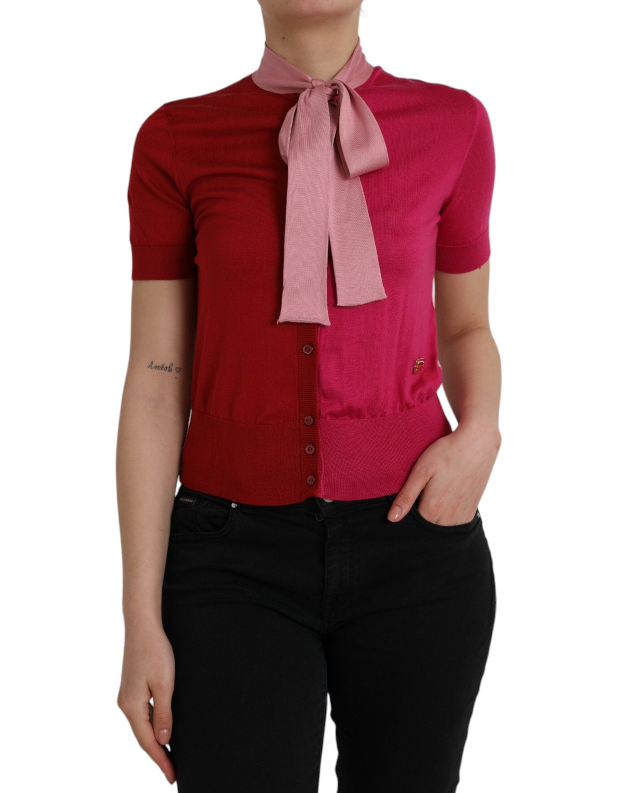 Pink Dolce & Gabbana short sleeve pullover top with ascot collar, showcasing a stylish and elegant fashion piece.
