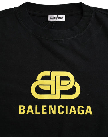 Balenciaga black cotton crew neck T-shirt with logo print, short sleeves and casual fit, displayed on a hanger.