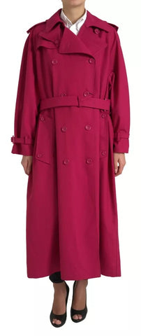 Dark pink Dolce & Gabbana double-breasted trench coat jacket hanging on a wooden hanger, showcasing its stylish design and fabric details.