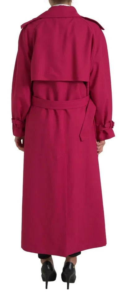 Dark pink double-breasted trench coat by Dolce & Gabbana, stylishly tailored with classic lapels and belt, on a mannequin.