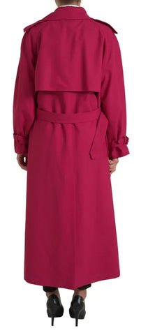 Dark pink double-breasted trench coat by Dolce & Gabbana, stylishly tailored with classic lapels and belt, on a mannequin.