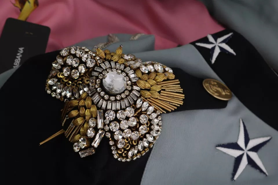 Blue cotton jacket by Dolce & Gabbana with crystal-embellished buttons and stylish design, shown on a model.