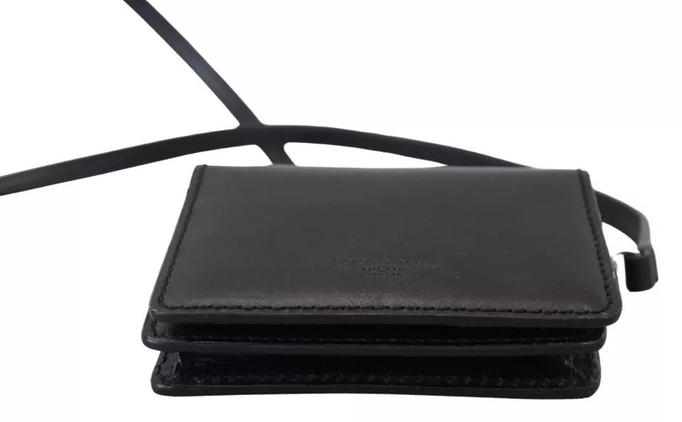 Black leather bifold shoulder sling wallet for women by Dolce & Gabbana, featuring multiple card slots and compact design.