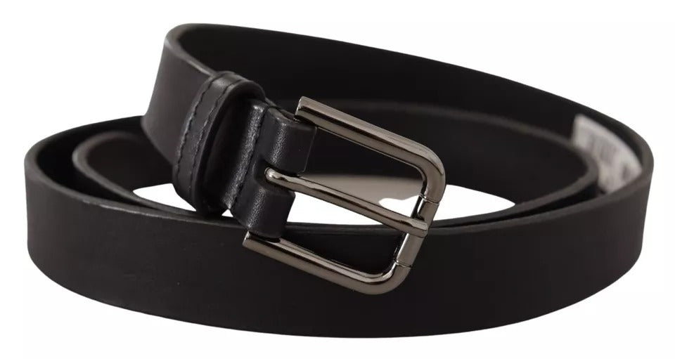 Black calf leather belt with a classic metal logo buckle from Dolce & Gabbana, featuring smooth leather and elegant design.